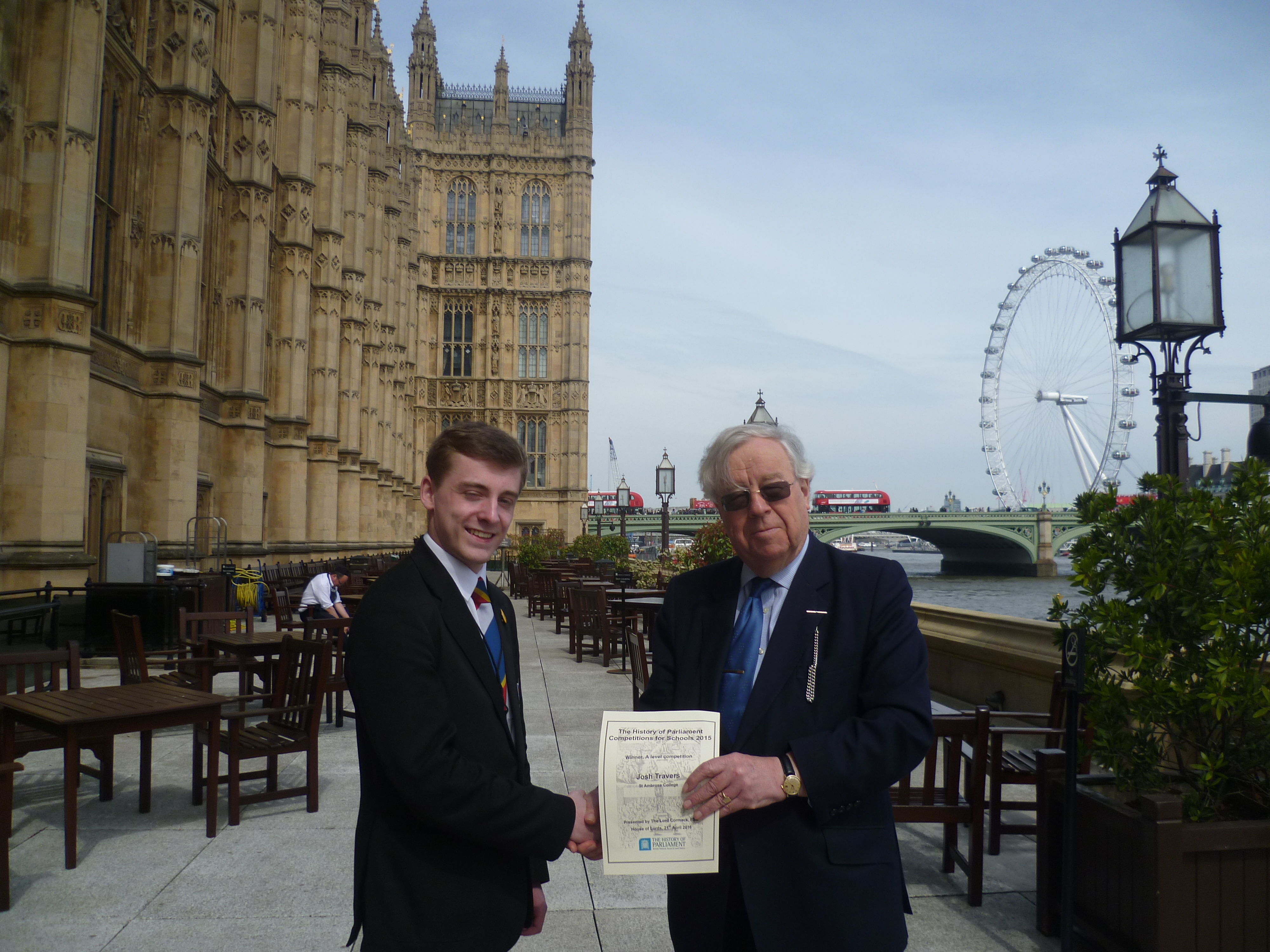 Josh receiving his prize from Lord Cormack