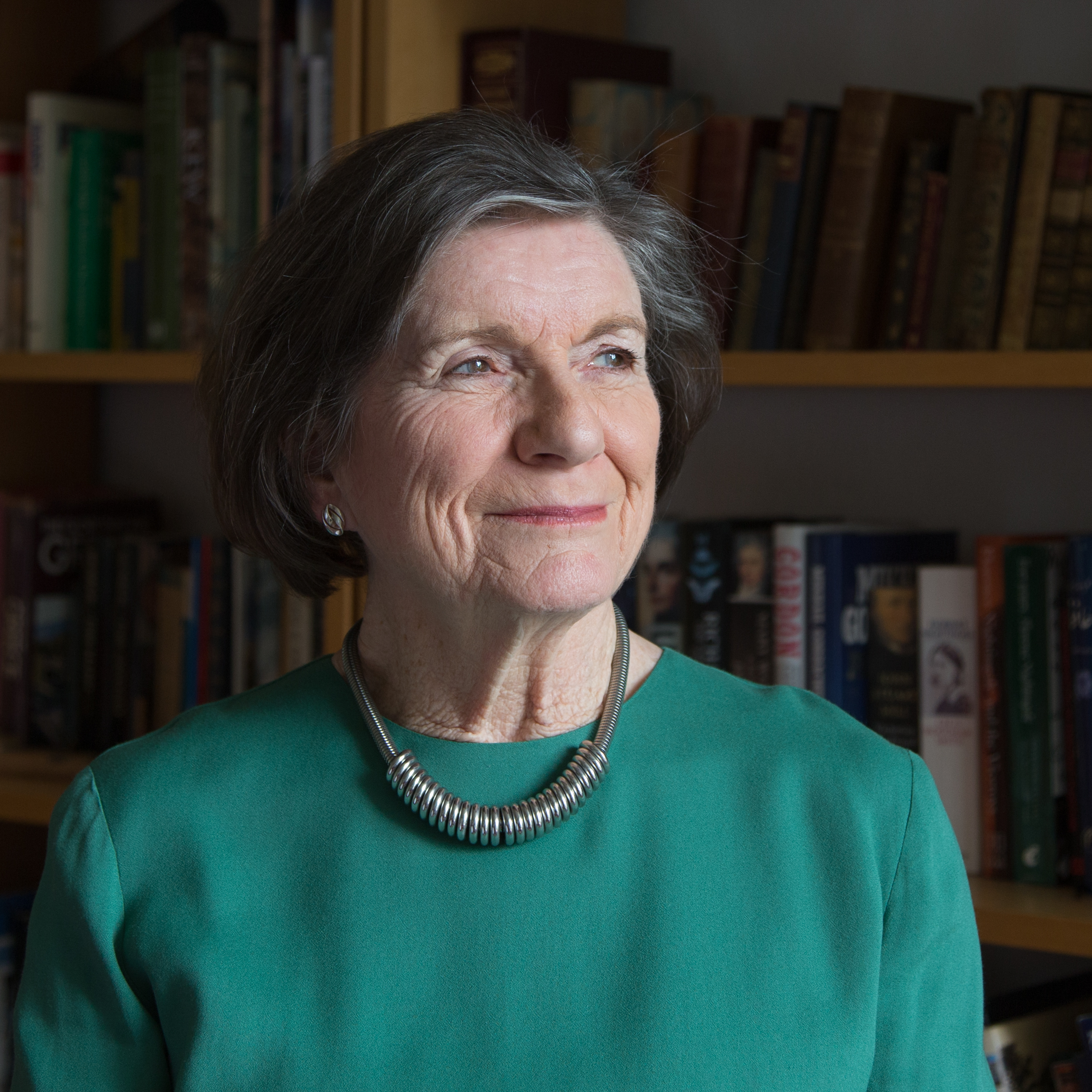 Photograph of the bust and head of Jenny Tonge who is wearing a green/blue top and a necklace.