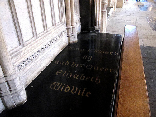 Photograph of the tomb of Edward IV and Elizabeth Woodville. Black rectangular shape. Writing reads: King Edward IIII and his Queen Elizabeth Widvile.