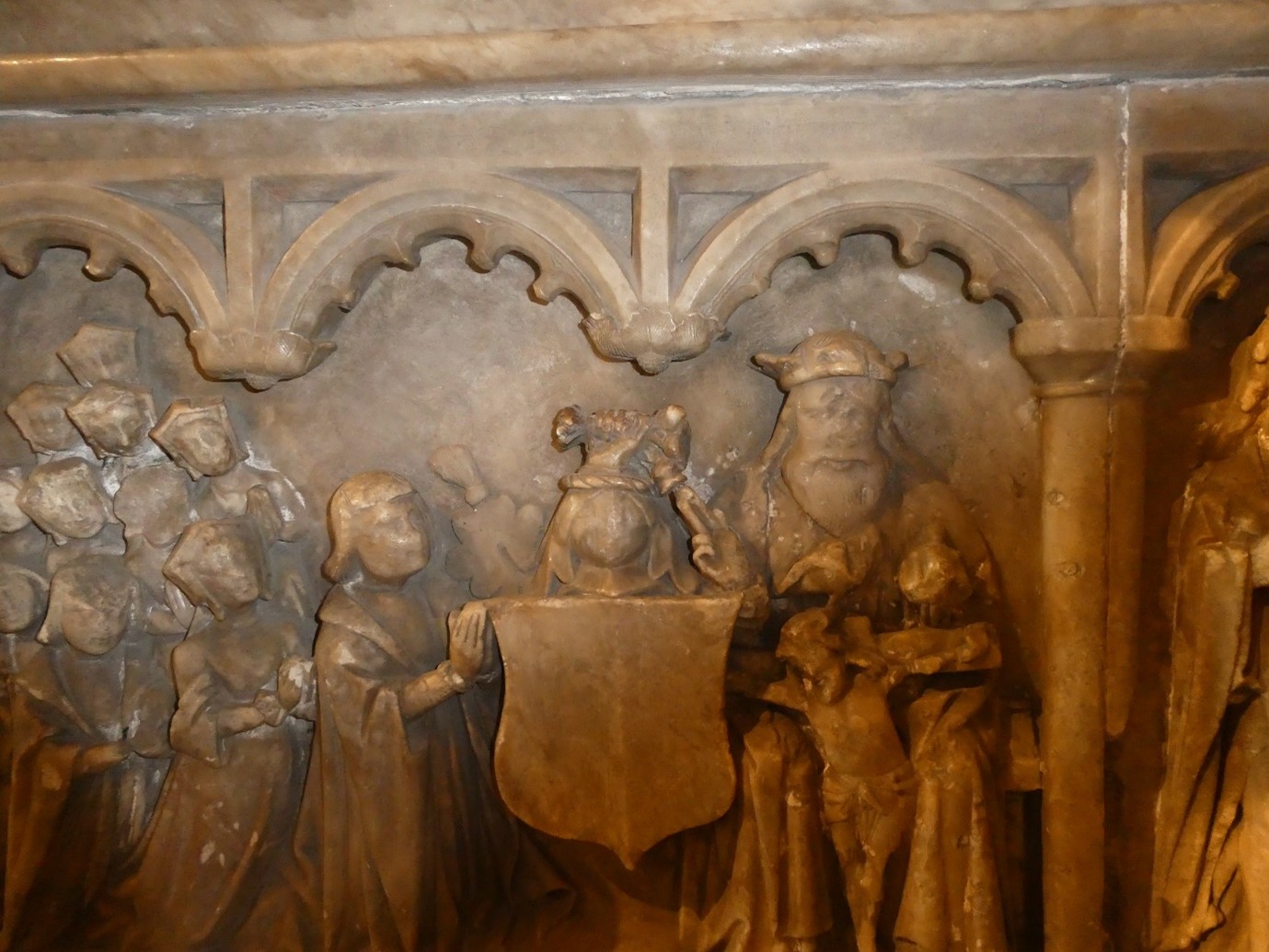 A panel of a tomb with multiple figures.