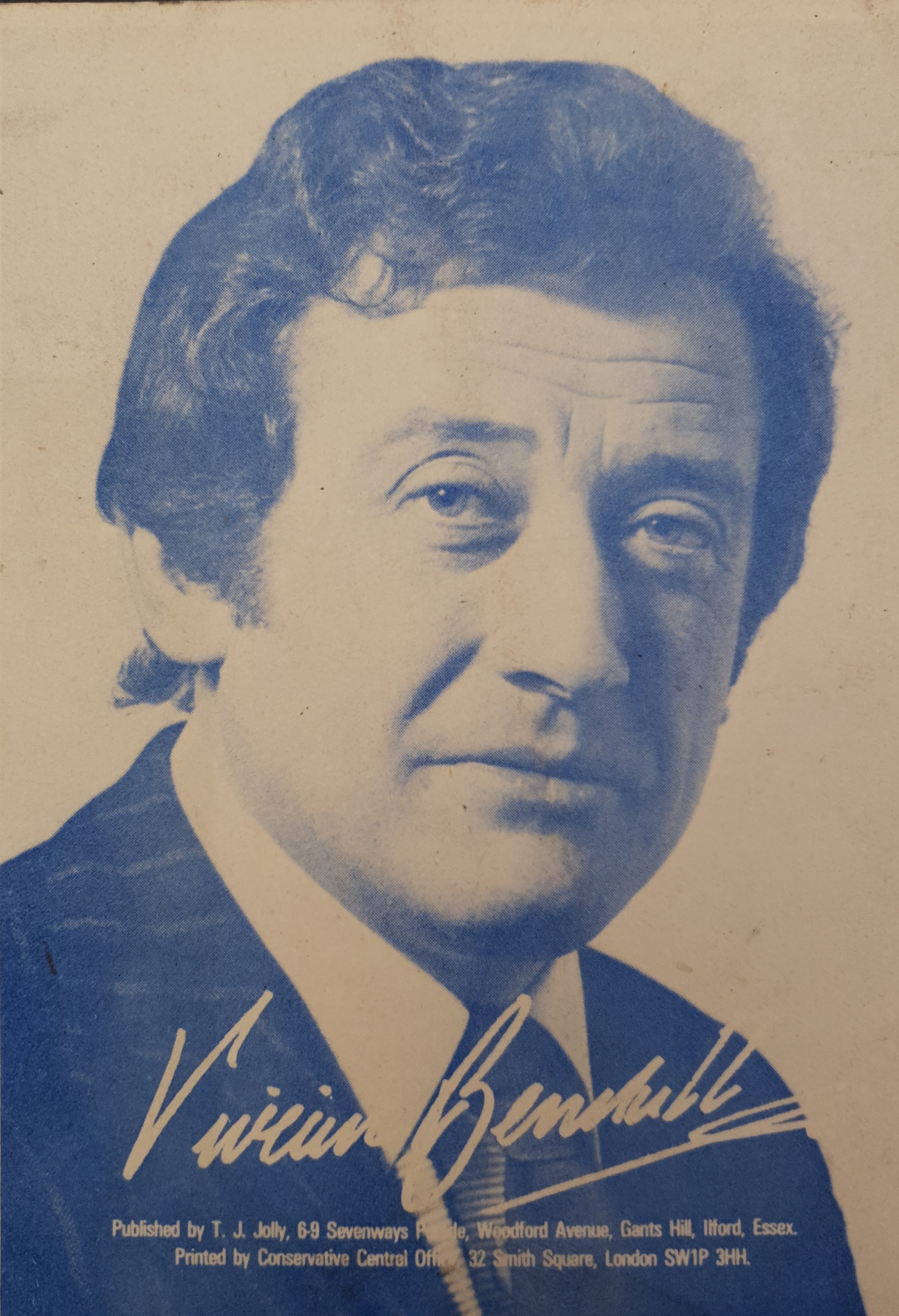 A calling card. The image is sepia toned of a white man with short, dark hair. He is wearing a suit with a tie. The name 'Vivian Bendall' is signed on it.