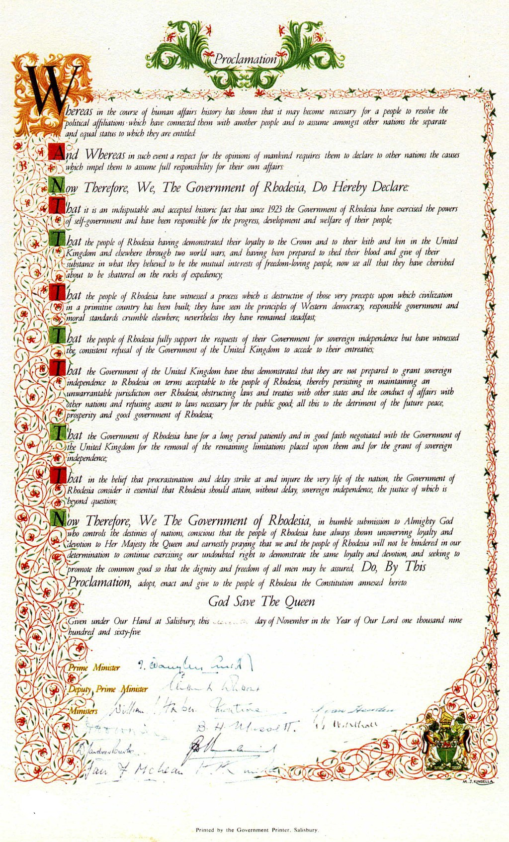 A proclamation document with at least 8 signatures at the bottom. The border of the document is ornate with a red and green pattern all around. 