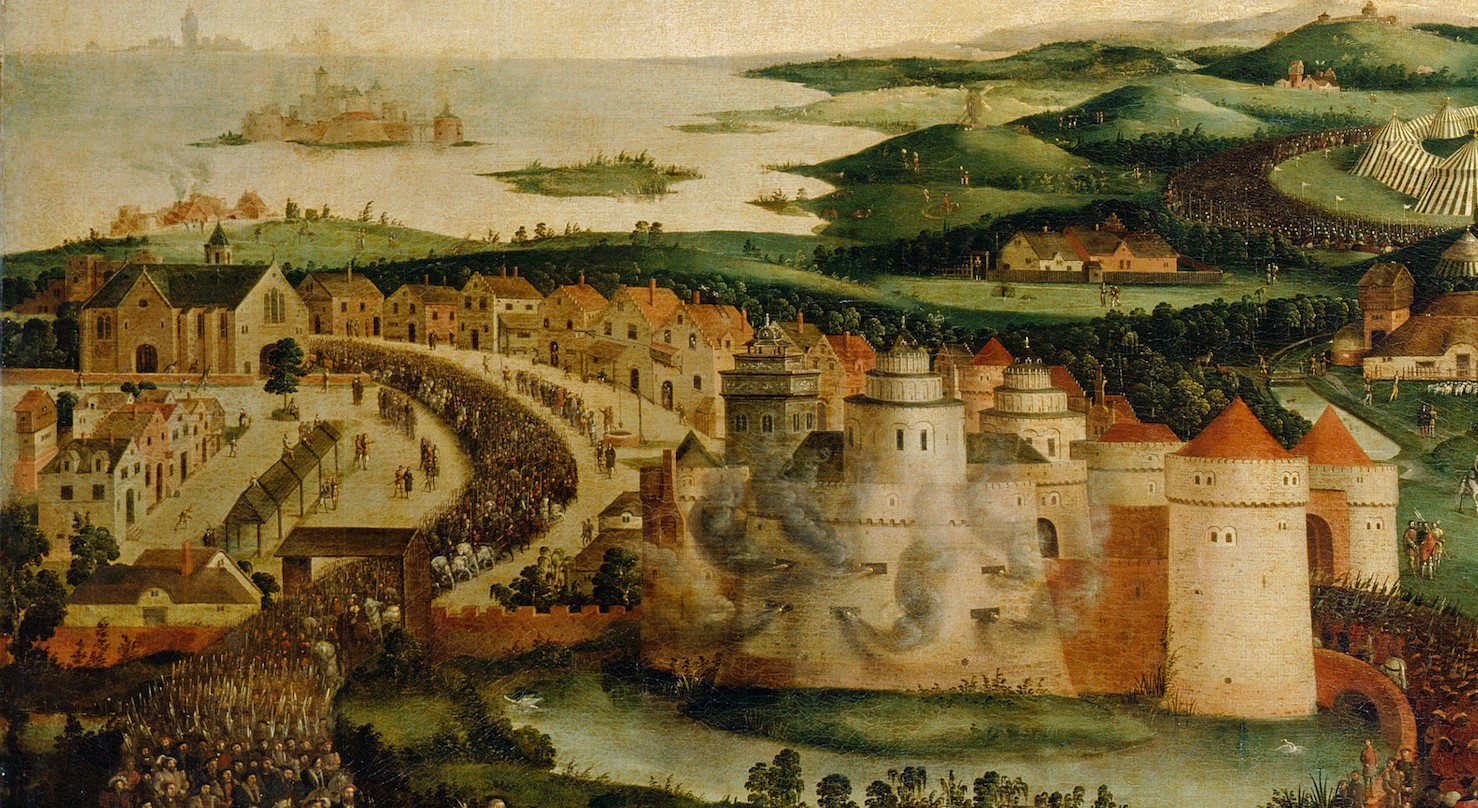 Painting showing Guines Castle. A fortified town is painted in a beige brick colour with red roofs, with smoke billowing out of the main castle keep. A large crowd of people are marching along the winding path through the town. In the background are rolling hills, large crowds and a tent, as well as the sea with a small habited island.