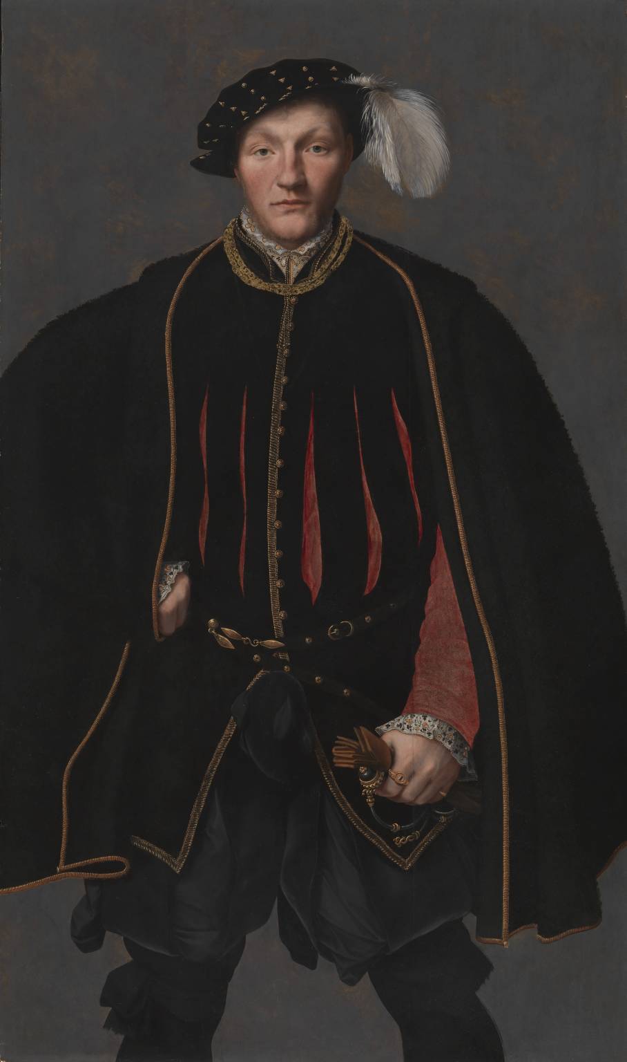 Painted portrait of a man, from the knee up. He is wearing a black doublet with faint red strips and red sleeves, black trousers, and a black cape with gold trim. He is wearing a black dotted bonnet with a white feather.