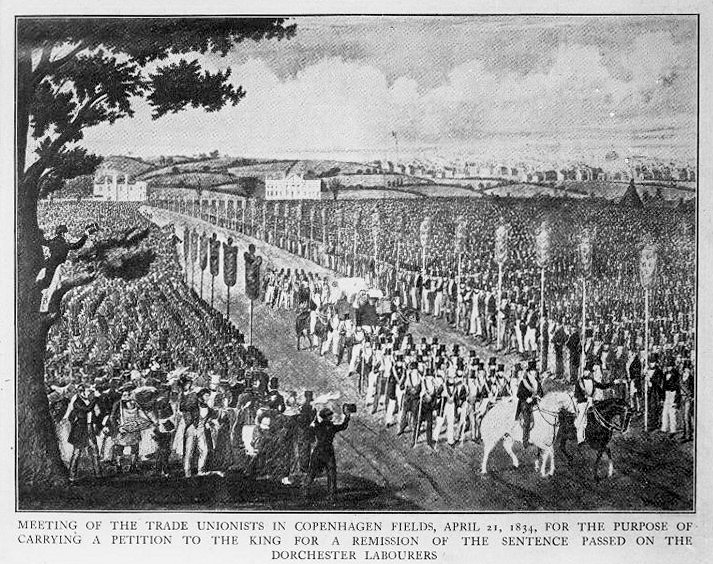 A painting of a procession led by two men on horseback progressing through an extensive crowd. The crowd is split by a wide dirt road of which the procession is walking through, and most attendants in the crowd have top hats on. Behind the crowds to the left is two large country house with rolling fields behind them, with London in the background to the right. The caption reads 'Meeting of the trade unionists in Copenhagen Fields, April 21, 1834. For the purpose of carrying a petition to the king for a remission of the sentence passed on the Dorchester labourers. 