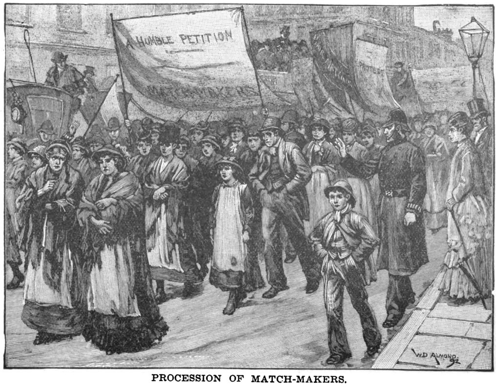 A black and white detail sketch of a procession of match-makers through a street in London. They are holding banners that reads A Humble Petition and Protest. There is a police officer gesturing to the procession on the right, with two wealthier looking people behind him. 