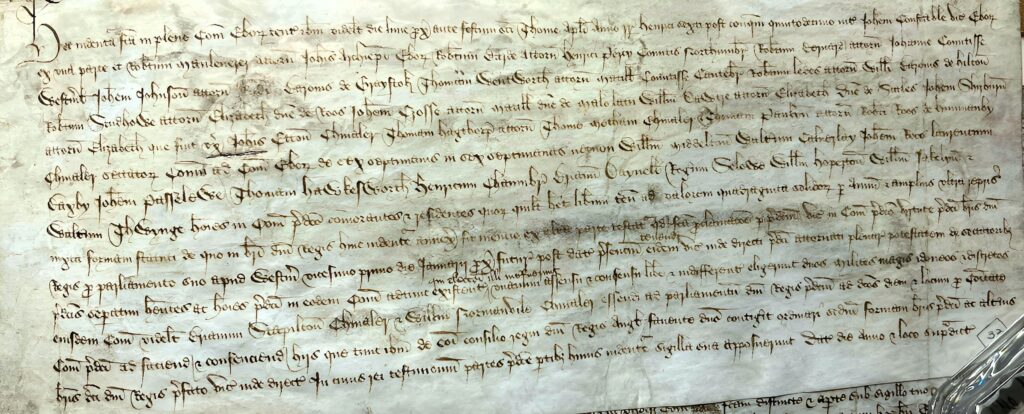 A picture of a document medieval document written in caligraphy. 