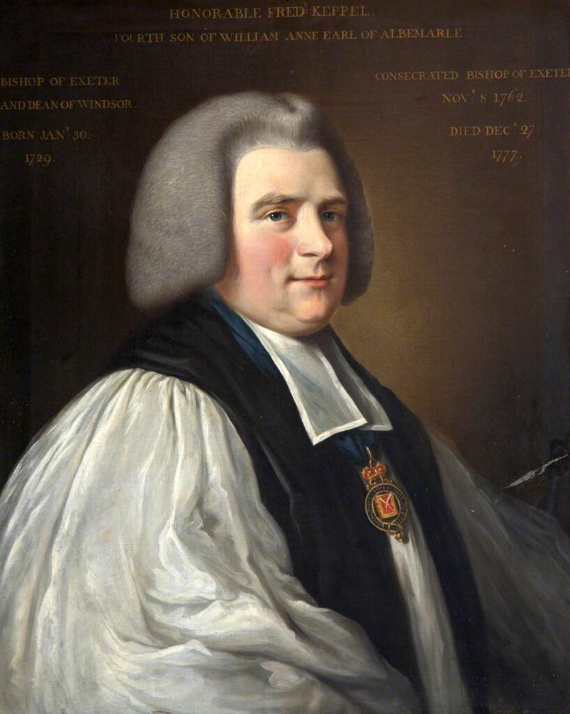 A half-length painted portrait of the bishop of Exeter. He is wearing a white rochet and black chimere. He is clean shaven wearing a short grey wig. 